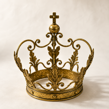 The crown, a large gold-colored, metallic beauty