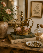The crown, a large gold-colored, metallic beauty