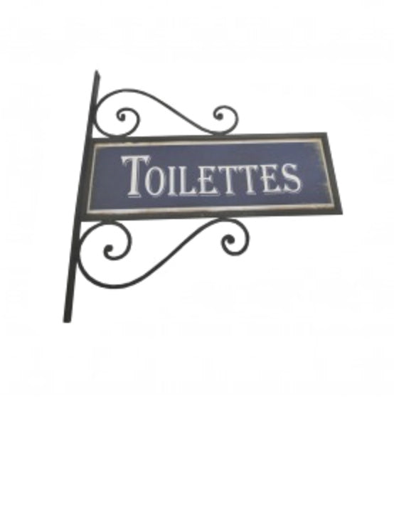 Opaskyltti vessaan kiehkurakoristeinen ranskalainen Toilettes, tumma sininen kyltti ja musta takorautapidike seinään La Petite Provence
